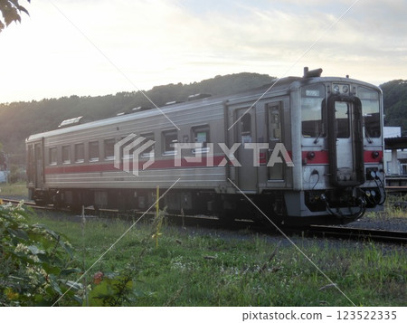 A local train (Kiha 54 series, Sekihoku Main Line) illuminated by the setting sun near the station (Hokkaido) A local train (Kiha 54 series, Sekihoku Main Line) illuminated by the setting sun near the station (Hokkaido) 123522335