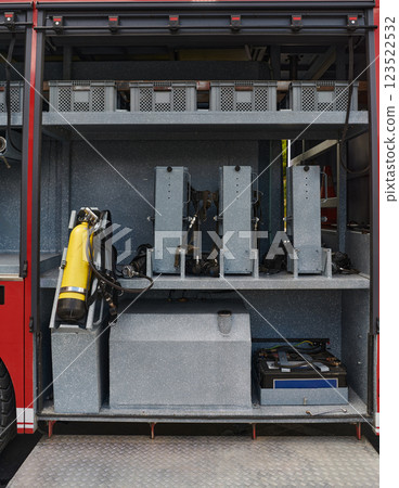 Close-up of essential firefighting equipment on a modern firetruck, showcasing tools and gear ready for emergency response to hazardous fire situations Close-up of essential firefighting equipment on a modern firetruck, showcasing tools and gear ready for emergency response to hazardous fire situations 123522532