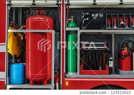 Close-up of essential firefighting equipment on a modern firetruck, showcasing tools and gear ready for emergency response to hazardous fire situations Close-up of essential firefighting equipment on a modern firetruck, showcasing tools and gear ready for emergency response to hazardous fire situations 123522622
