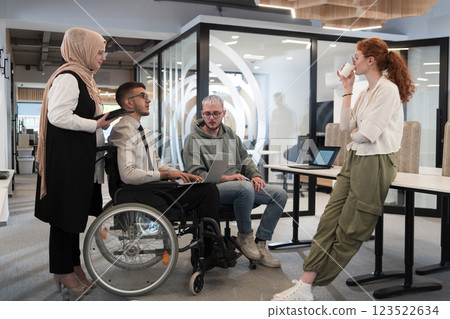 Young group of business people brainstorming together in a startup space, discussing business projects, investments, and solving challenges. 123522634