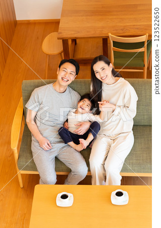 A young family relaxing in the living room A young family relaxing in the living room 123522650