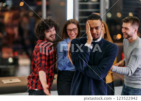 A group of young business people have fun playing interesting games while taking a break from work in a modern office. Selective focus  123522942
