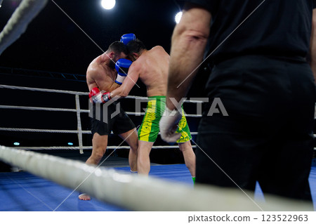 Fierce boxing match showcases athletes' power and skill. Fierce boxing match showcases athletes' power and skill. 123522963