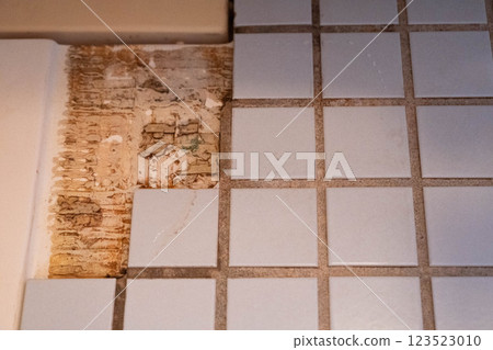 Photo of old peeling tile floor Photo of old peeling tile floor 123523010