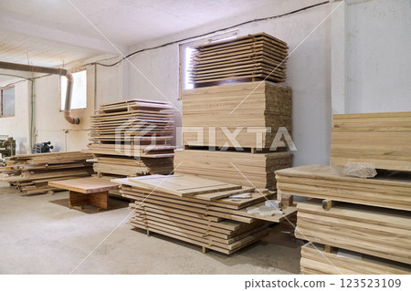 Wooden Parts and Boards Stored in Warehouse Ready for CNC Machine Processing Wooden Parts and Boards Stored in Warehouse Ready for CNC Machine Processing 123523109