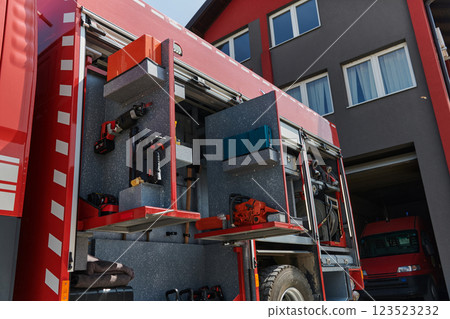 Close-up of essential firefighting equipment on a modern firetruck, showcasing tools and gear ready for emergency response to hazardous fire situations 123523232