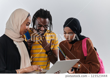 A group of students, including an African American student and two hijab-wearing women, stand united against a pristine white background, symbolizing a harmonious blend of cultures and backgrounds in 123523444