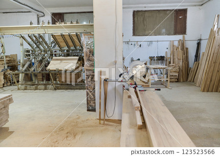Interior of Wood Processing Industry Featuring CNC Cutting Machines and Wood Processing Equipment 123523566