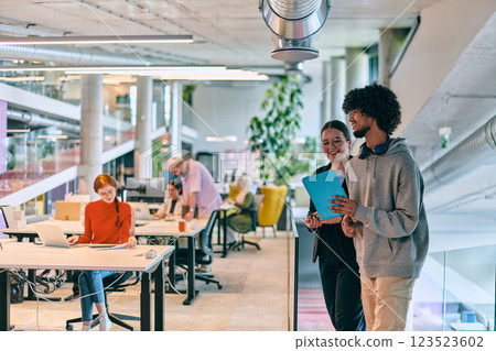 In a modern startup office, a diverse group of young professionals collaboratively tackles various business problems and challenges, surrounded by their engaged colleagues, fostering innovation and 123523602