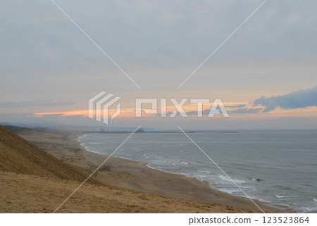 Sand dunes and ocean, desert sunset 123523864