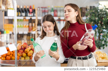 Mother and daughter choose soda 123525460