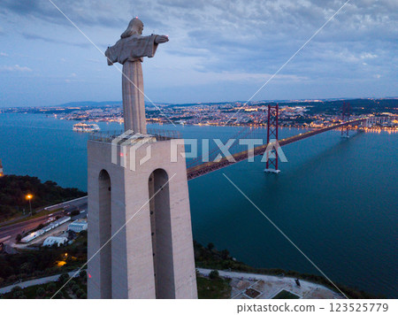 Illuminated Lisbon and 25th April Bridge Illuminated Lisbon and 25th April Bridge 123525779