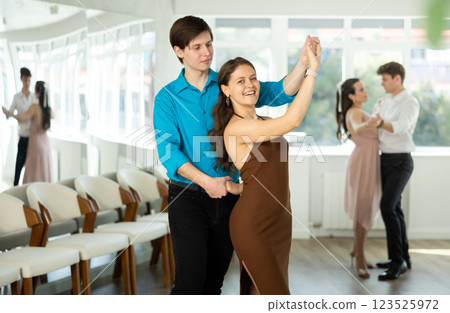 Couple young woman and man dancing waltz Couple young woman and man dancing waltz 123525972