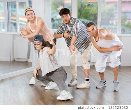 Women and men improvise, move on whim, and perform voluntary movements hip hop dance Women and men improvise, move on whim, and perform voluntary movements hip hop dance 123525980