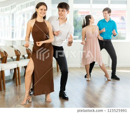 Couple young woman and man dancing twist Couple young woman and man dancing twist 123525991