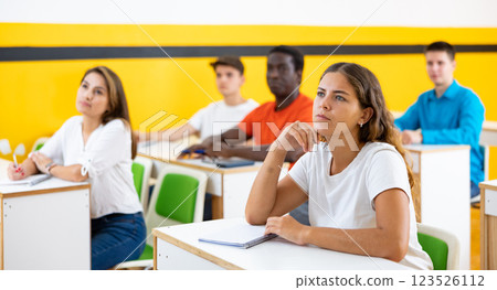 Woman in group of students in university audience 123526112