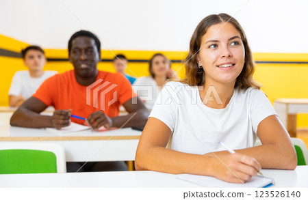 Young woman attending lecture in taxi training school 123526140
