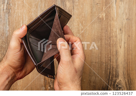 Struggles of everyday finance faced by a businessman in tough times 123526437