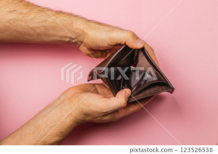 Open wallet showing emptiness and financial struggle in modern economy Open wallet showing emptiness and financial struggle in modern economy 123526538