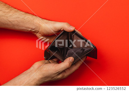 Empty wallet reflects financial struggles and the impact of economic crisis Empty wallet reflects financial struggles and the impact of economic crisis 123526552