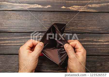 Financial despair leads to an empty wallet reflecting personal crisis 123526557