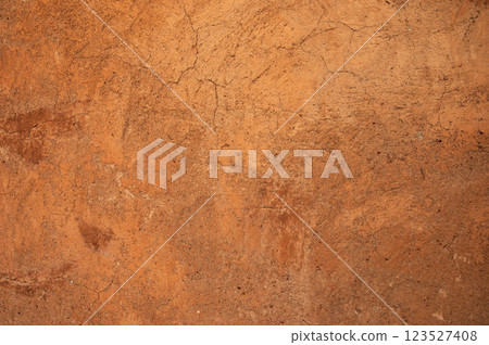 Full frame shot of an earthen wall texture of clay house structure. Full frame shot of an earthen wall texture of clay house structure. 123527408