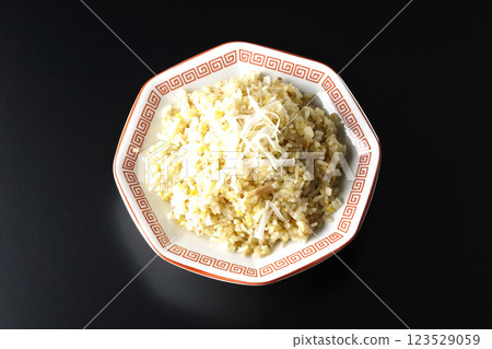 Fried rice photographed alone against a black background 123529059