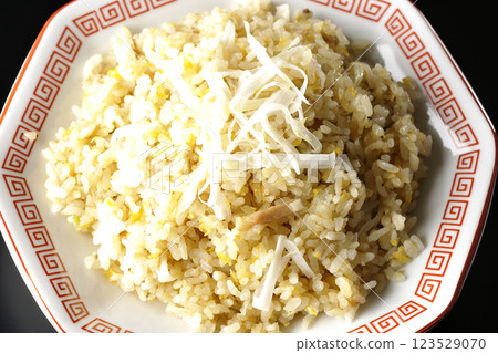 Fried rice photographed alone against a black background Fried rice photographed alone against a black background 123529070