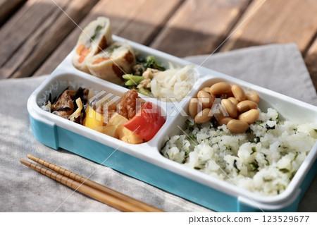 Homemade Japanese bento box using a bento box with integrated dividers Homemade Japanese bento box using a bento box with integrated dividers 123529677