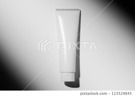 White plastic tube mockup for cosmetics, skincare products on light background with shadows, branding, packaging design, advertising, and promotional use 123529845