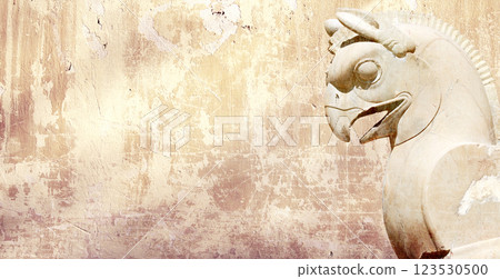 Background with stone statue of mythical griffin, Persepolis, Iran. Horizontal banner with assyrian protective deity. Topic of summer vacation, travel, trip abroad on vacation, cruises and tours 123530500