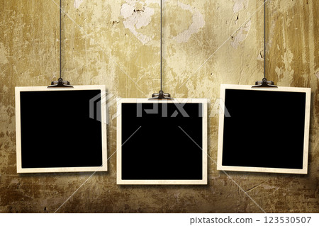 Photos hanging on paper clips against wall. Nostalgic Picture album with old photoframe. Template with three retro frame photos. Moodboard pictures album for scrapbooking. Vintage style mood board Photos hanging on paper clips against wall. Nostalgic Picture album with old photoframe. Template with three retro frame photos. Moodboard pictures album for scrapbooking. Vintage style mood board 123530507