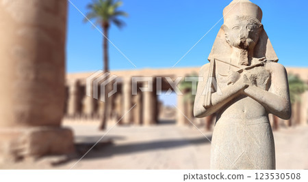 Horizontal banner with pharaoh statue, palm and ancient, Karnak Temple Complex, Luxor (ancient Thebes), Egypt, North Africa 123530508