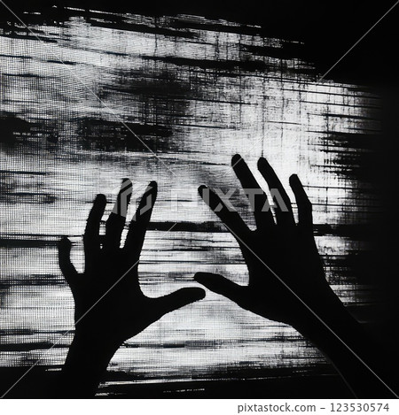 monochrome dark silhouettes of hands on the wall in grunge style. damaged film 123530574