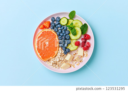 A plate divided into low fat food groups artistically promotes balanced eating and nutrition 123531295