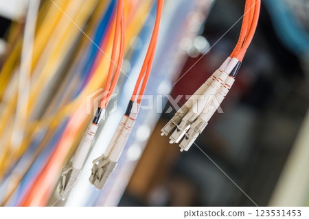Detail of server room with bunch of fiber optic cables at the ba Detail of server room with bunch of fiber optic cables at the ba 123531453