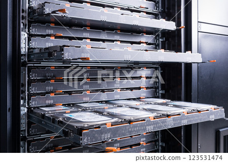 Cluster of hard drives inside open tray Cluster of hard drives inside open tray 123531474