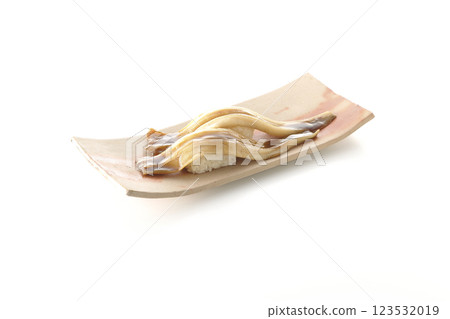A single piece of conger eel sushi photographed on a white background 123532019