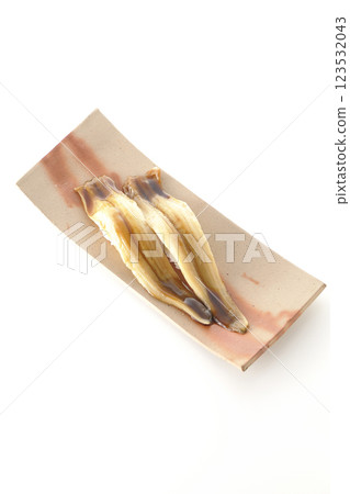 A single piece of conger eel sushi photographed on a white background 123532043
