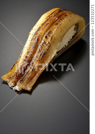 Grilled conger eel sushi photographed against a black background Grilled conger eel sushi photographed against a black background 123532271