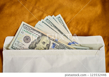 Dollar bills in envelope. Corruption and illegal cash payments Dollar bills in envelope. Corruption and illegal cash payments 123532446