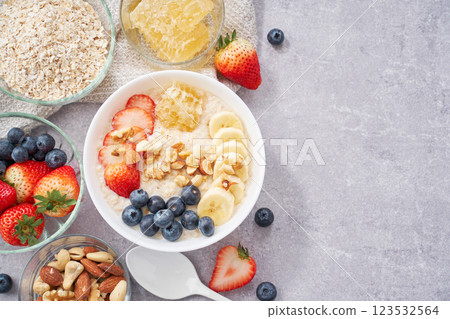 Oatmeal breakfast – topped with fruit and nuts 123532564