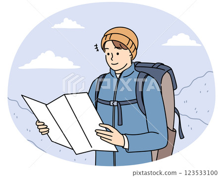 Male traveler check map trekking in mountains 123533100