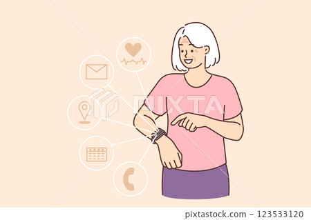 Fitness bracelets or smartwatch on hand elderly woman using gadget to make call or measure heartbeat 123533120
