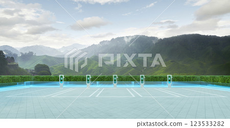 Electric vehicle charging station with green mountain view promoting sustainable transportation Electric vehicle charging station with green mountain view promoting sustainable transportation 123533282