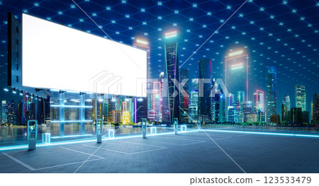 Electric vehicle charging station with blank billboard and futuristic city skyline Electric vehicle charging station with blank billboard and futuristic city skyline 123533479