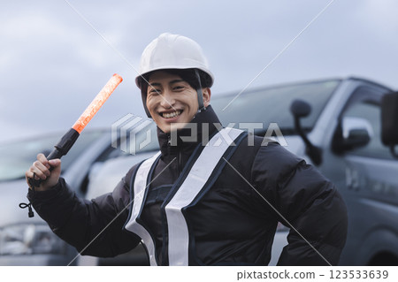 Worker standing in front of the truck 123533639