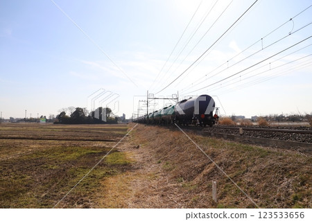 A freight train running in the suburbs of Hasuda City, Saitama Prefecture in winter A freight train running in the suburbs of Hasuda City, Saitama Prefecture in winter 123533656