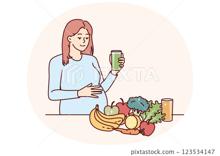 Pregnant woman drinks juice from fresh fruits and vegetables standing near steel with healthy food 123534147