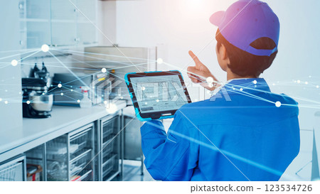 Worker inspecting with tablet and communication network image 123534726